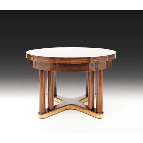 EXTRAORDINARY ROUND EXTENDING DINING TABLE
