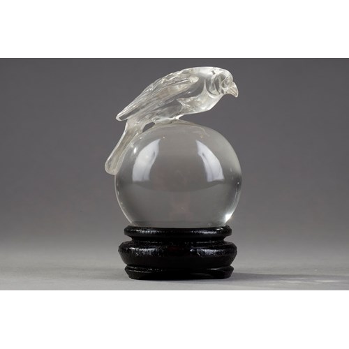 Small sphere in pure rock crystal surmounted by a raptor -China 19em century