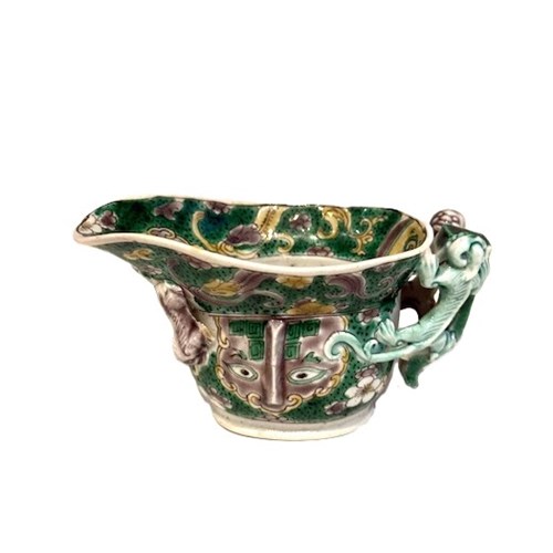 Bowl of libatory biscuit decorated with  "shi" dragons and masks and prunus flowers in enamels from the Famille Verte China period Kangxi 1662/1722