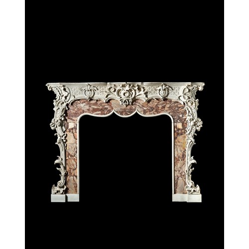 An Outstanding Rococo Carved Fire Surround Retaining its Original White Painted Decoration