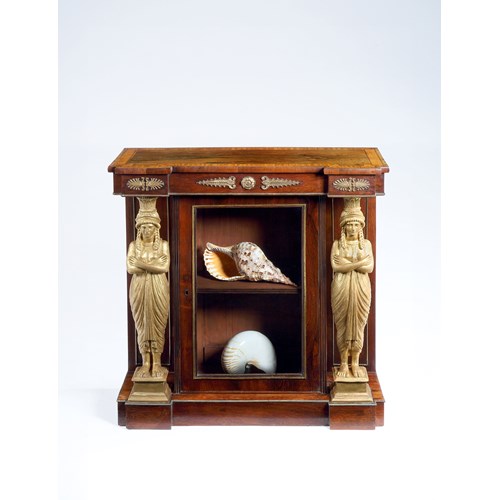 A rare rosewood satinwood and carved giltwood side cabinet