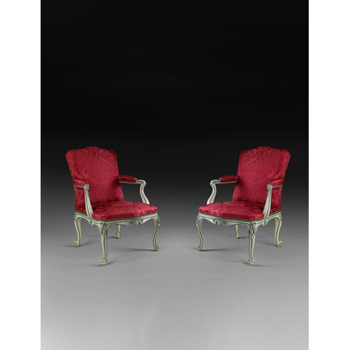 A rare pair of blue and white painted armchairs from Easton Neston house