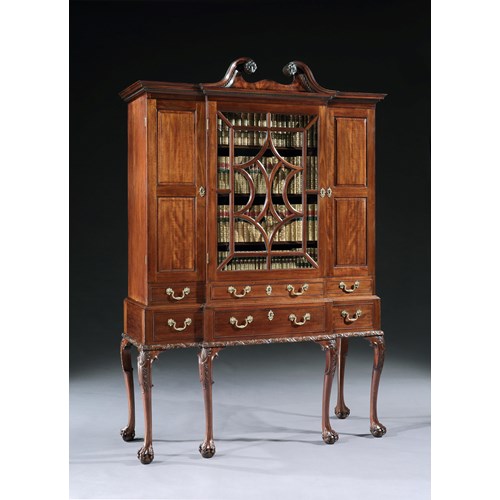 A GEORGE II MAHOGANY BREAKFRONT SECRÉTAIRE CABINET ON STAND 