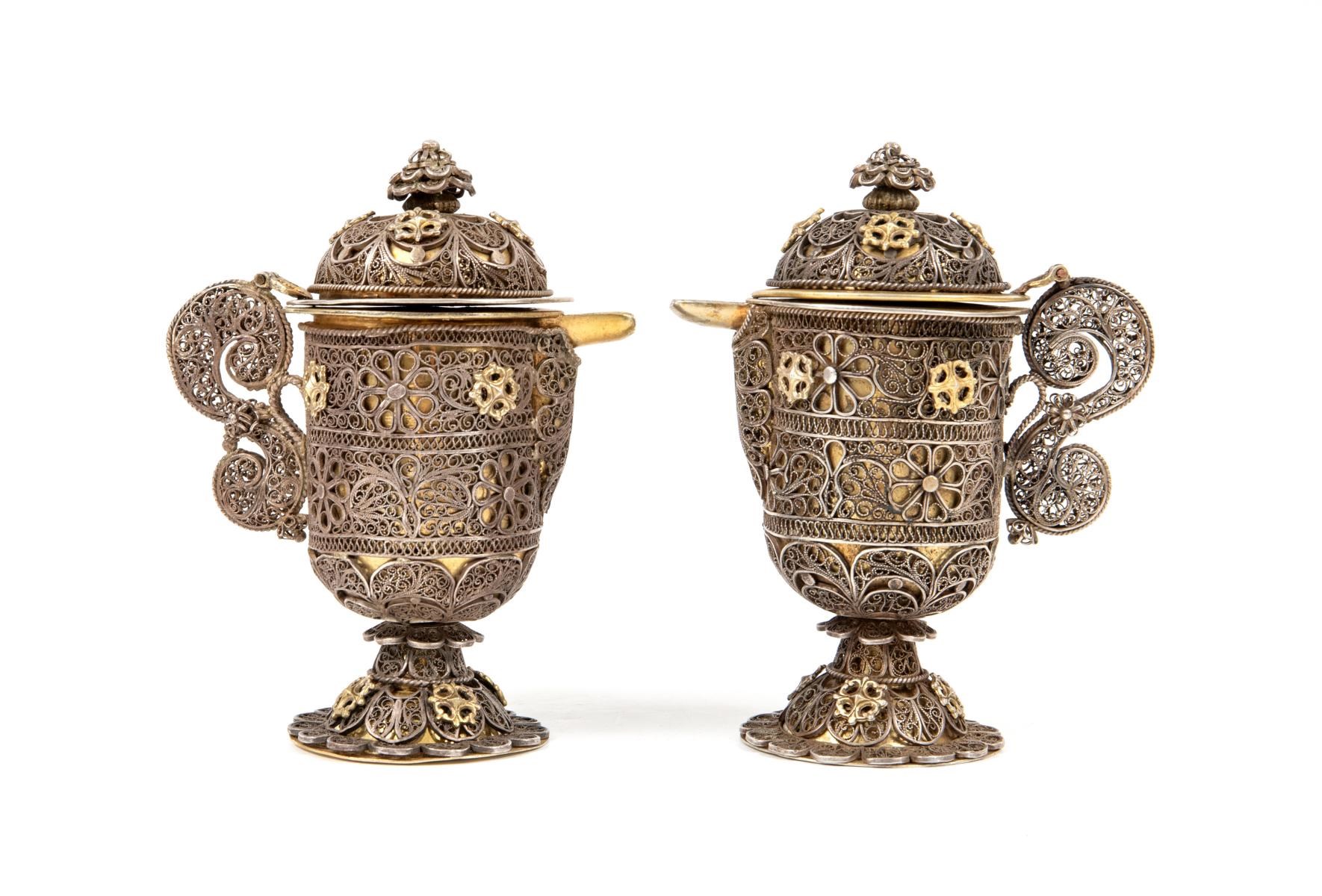 A pair of gilt filigree cruets