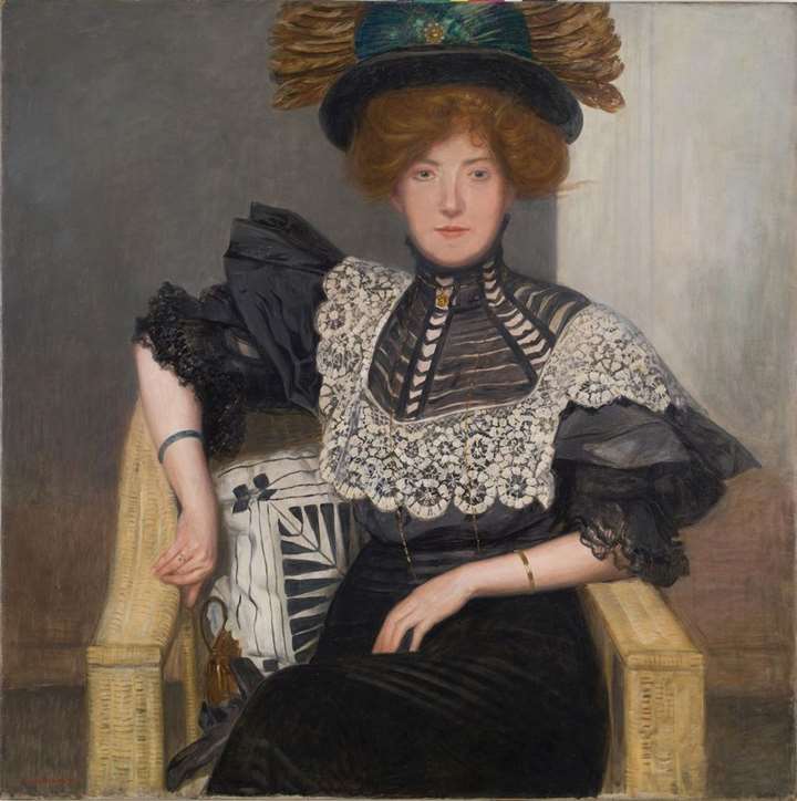 PORTRAIT OF A LADY WITH LACE BLOUSE AND FEATHERED HAT