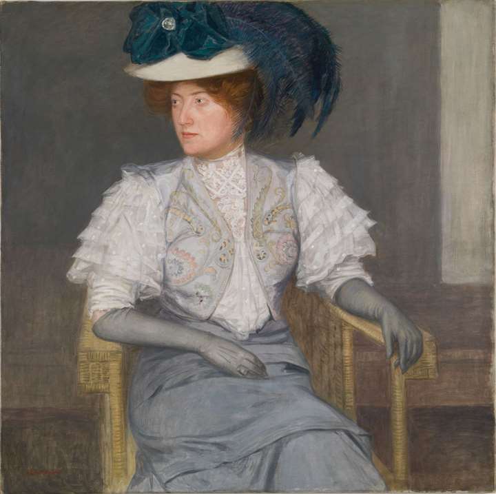 PORTRAIT OF A LADY WITH GREEN FEATHERED HAT AND BOW