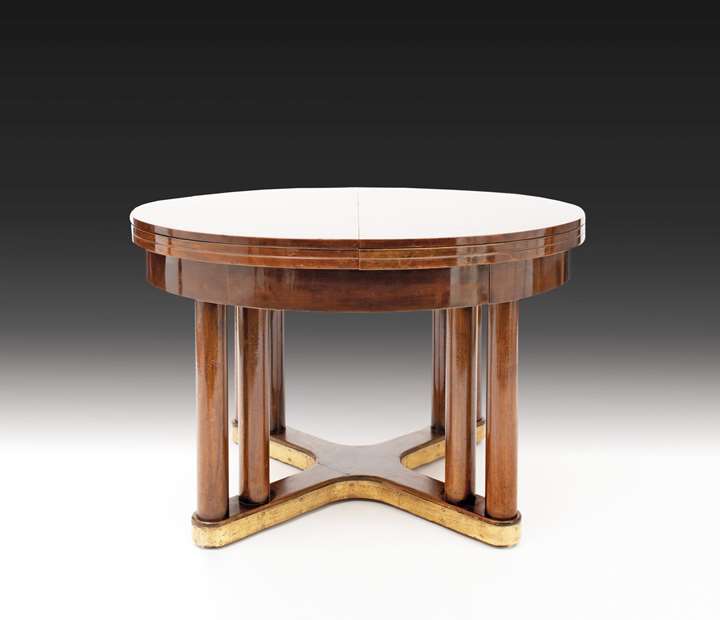 EXTRAORDINARY ROUND EXTENDING DINING TABLE