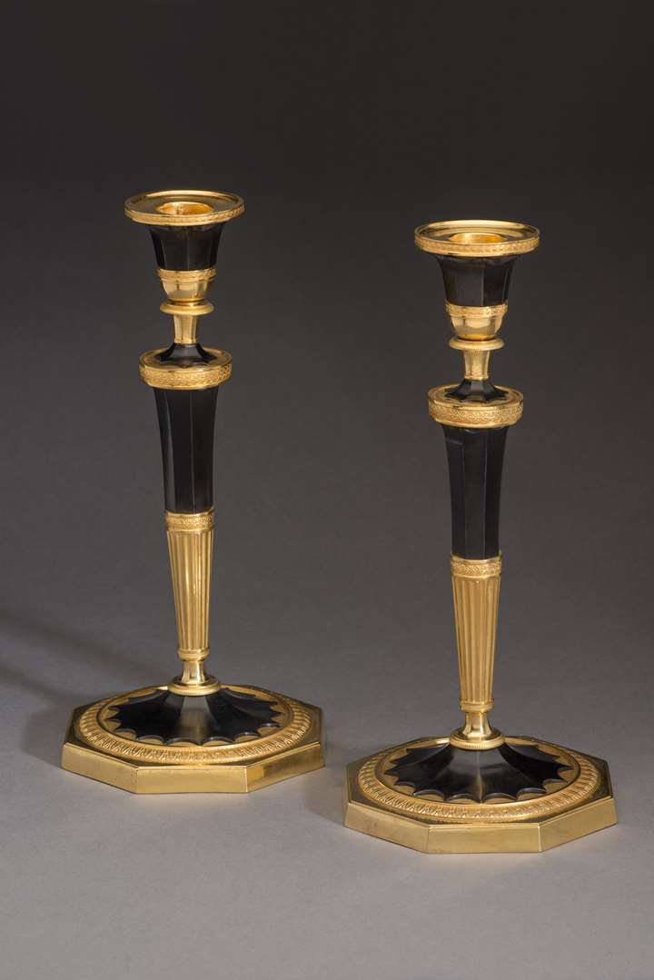 A pair of Empire Ormolu candlesticks