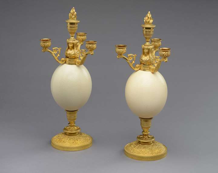 A pair of restauration ostrich eggs ormolu mounted four branches candelabra