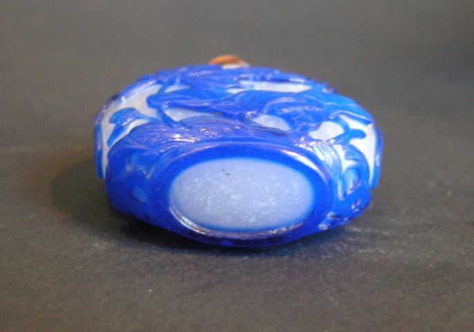 Snuff Bottle glass overlay blue sculpted with Lotus and flowers Qianlong period | MasterArt
