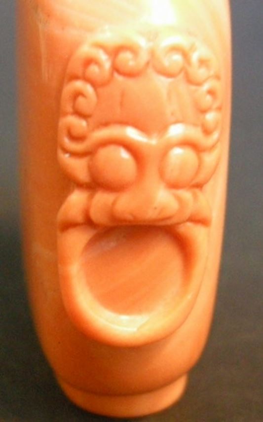 Rare coral snuff bottle sculpted with mask and ring handles | MasterArt
