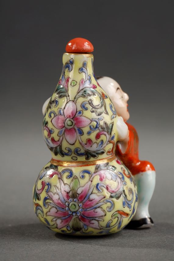 Snuff bottle porcelain in shape of a children holding a double gourd | MasterArt