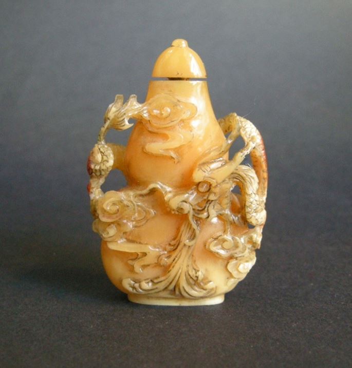 Rare snuff bottle in the form of a double gourd in hornbill sculpted from a dragon around it | MasterArt