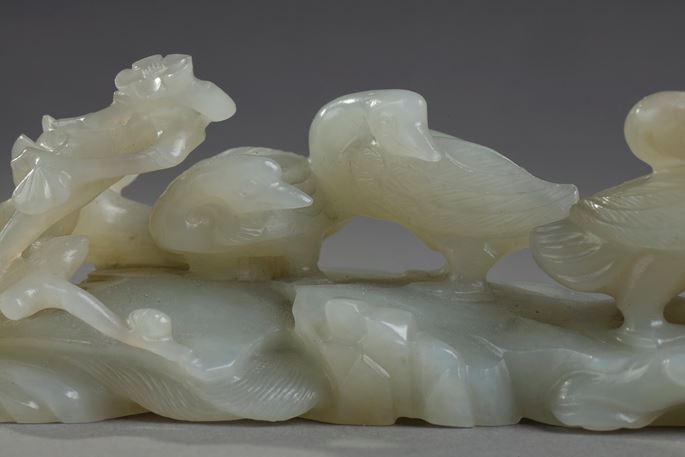 Nephrite celadon jade brush rest carved with three ducks next to a branch of prunus and also forming a water bucket - China 18/19em | MasterArt