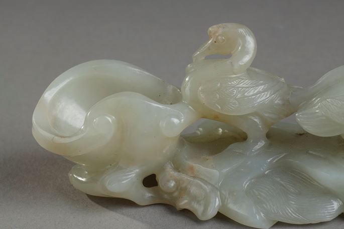 Nephrite celadon jade brush rest carved with three ducks next to a branch of prunus and also forming a water bucket - China 18/19em | MasterArt