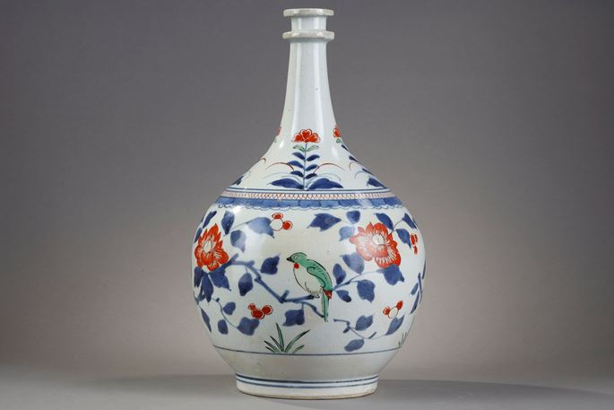 Bottle pharmacy with double ring collar. porcelain decorated in blue under cover and polychrome enamels of birds among the branches of pomegranate peony and camellia Japan  Arita  kilns late 17th century | MasterArt