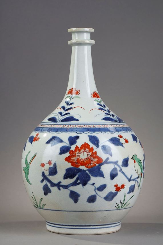 Bottle pharmacy with double ring collar. porcelain decorated in blue under cover and polychrome enamels of birds among the branches of pomegranate peony and camellia Japan  Arita  kilns late 17th century | MasterArt