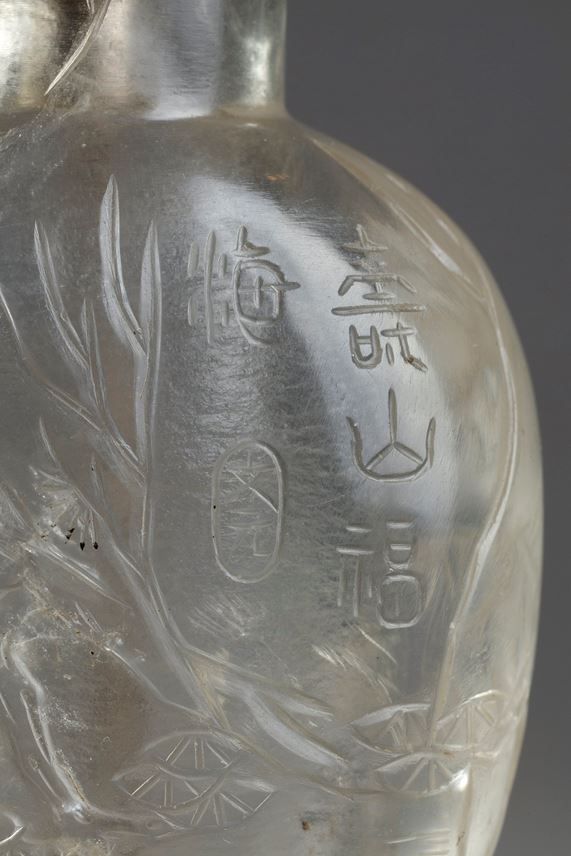 Rock crystal snuff bottle sculpted in low relief with liu hai, bat, crane | MasterArt