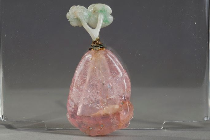 Tourmaline snuff bottle carved in the shape of fruit with foliage and flowers. Jadeite stopper carved in the shape of flowers ... | MasterArt