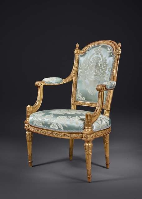 A FINE AND RARE SET COMPRISING TWO ARMCHAIRS AND TWO CHAIRS IN CARVED AND GILDED WOOD