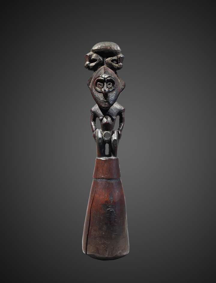 A food pounder representing a male ancestor figure.