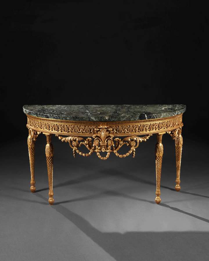 A giltwood and marble topped pier table