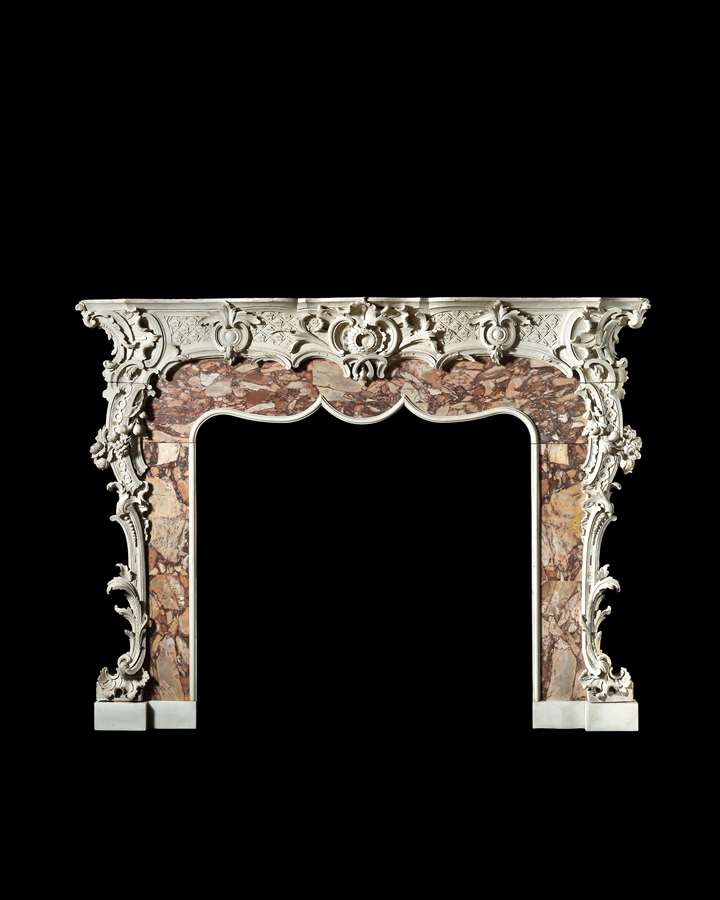 An Outstanding Rococo Carved Fire Surround Retaining its Original White Painted Decoration