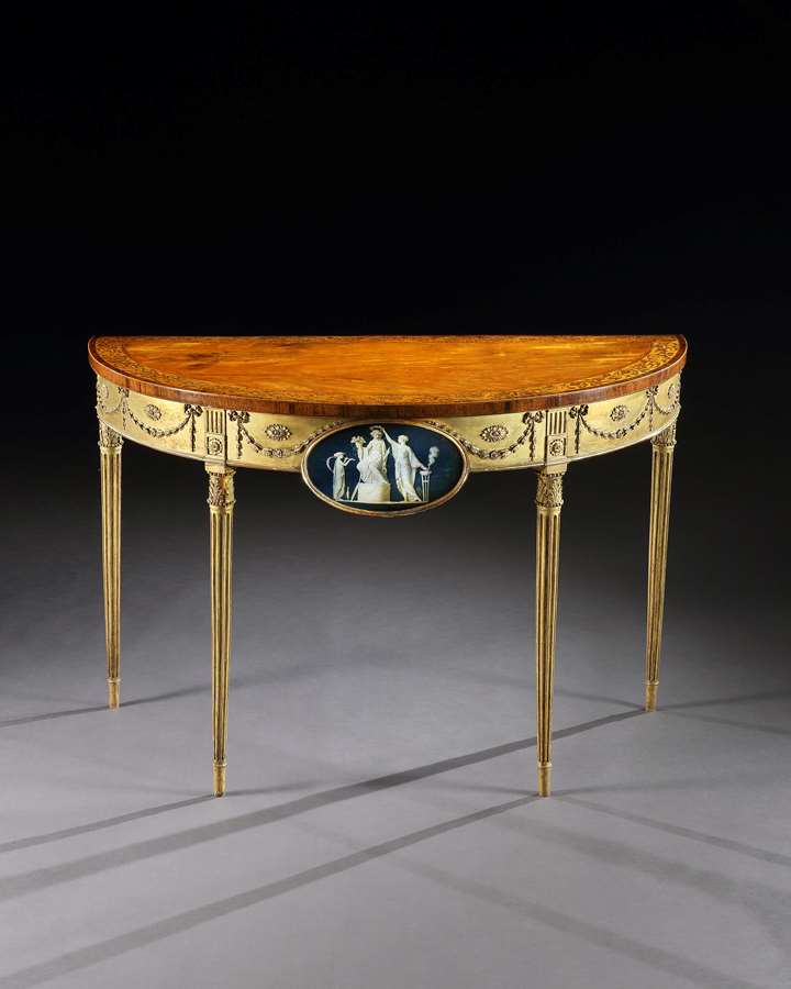 A George III Satinwood Marquetry Giltwood and Composition Demi-Line Side Table