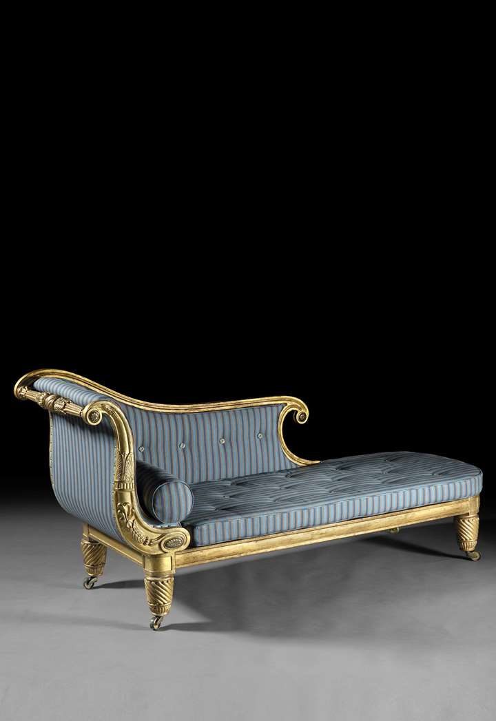 An exceptional Regency period carved giltwood daybed