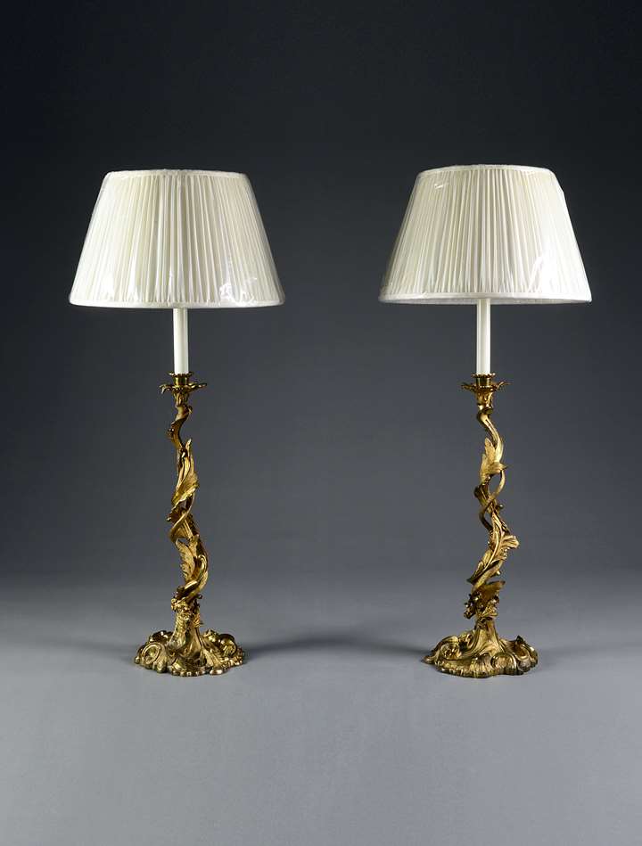 An exceptional pair of gilt bronze candlesticks