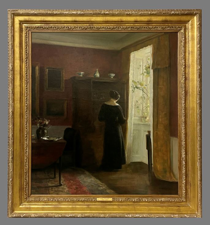 Carl Vilhelm Holsøe - Interior with woman by the window | MasterArt
