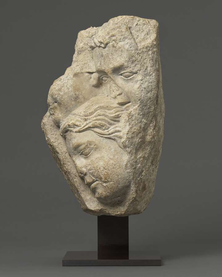 Relief with Group of Faces