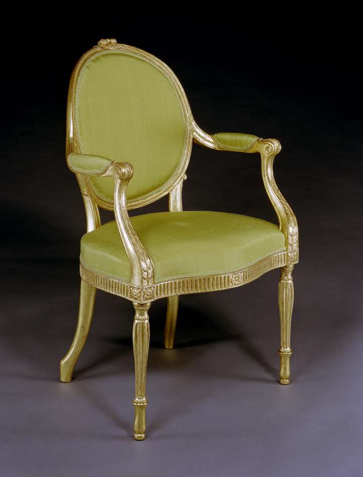 A GEORGE III GILTWOOD ARMCHAIR