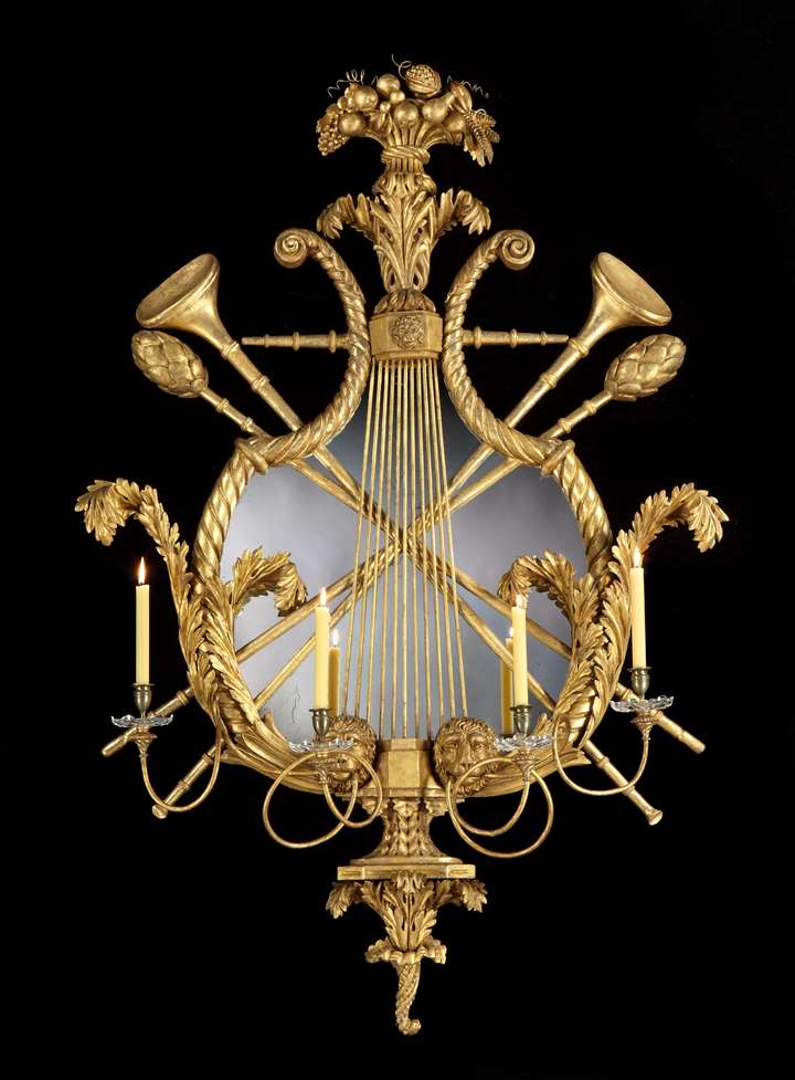 A MASSIVE CONTINENTAL REGENCY PERIOD GILTWOOD FOUR LIGHT GIRANDOLE