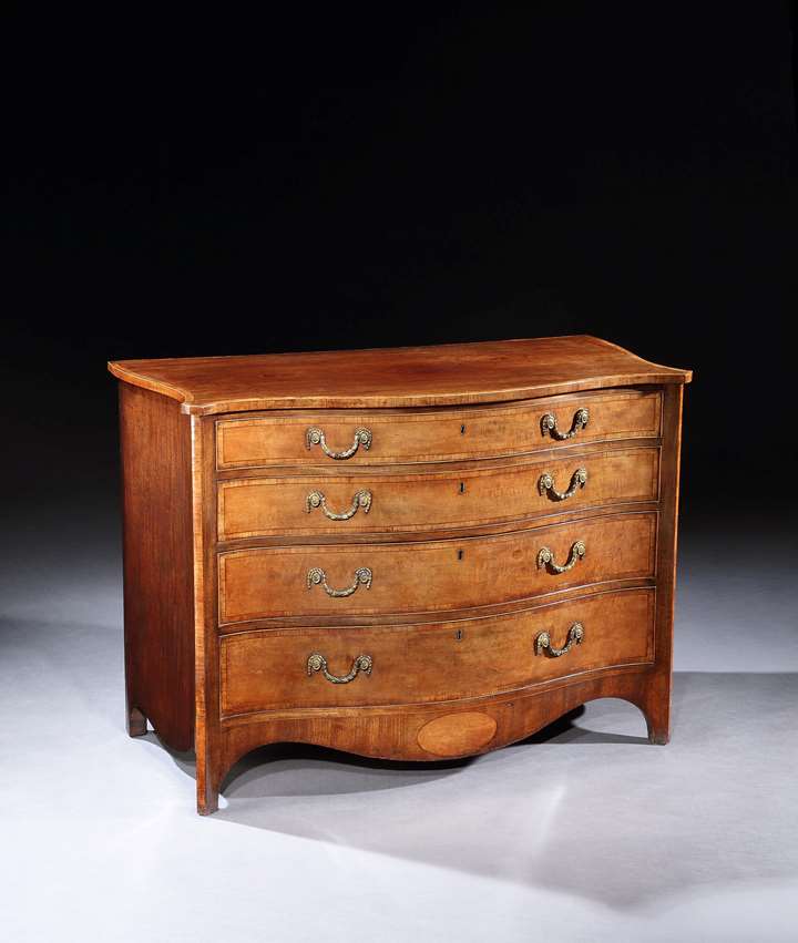 A GEORGE III SATINWOOD AND MAHOGANY CHEST OF DRAWERS