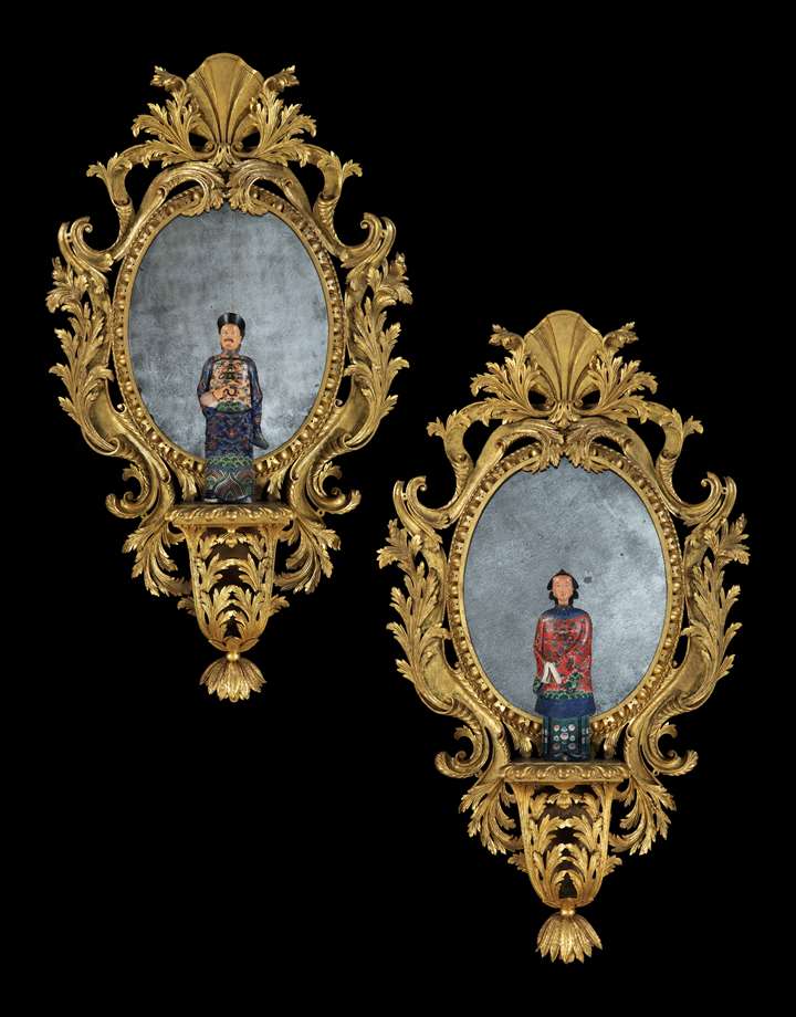 A pair of giltwood mirrors with brackets